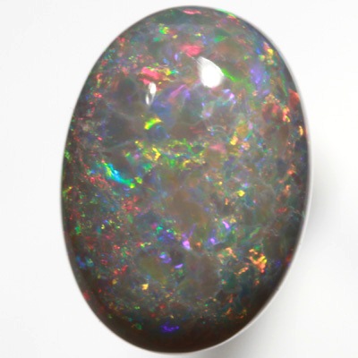 SOLID SEMI BLACK OPAL Bright red and green floats over a beautiful rare purple mauve SEE VIDEO